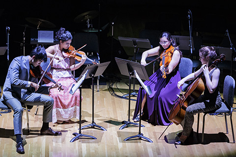 Strings ensemble playing live on stage